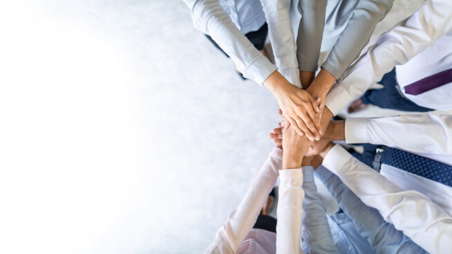 Clasped hands in a circle